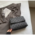Detail of grey textured fabric bag with embroidered bow knots and metal chain strap - Dark Grey Polka Dot (Black Bow)