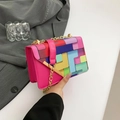 Pink crossbody bag with colorful geometric blocks and golden metal chain strap - Rose Red