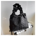 Elegant black pleated shoulder bag with silver rivet details on white suitcase - Black
