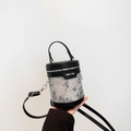 Chic black and silver jacquard bucket bag with floral embroidery and top handle - Black & White