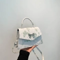 White butterfly print square handbag with silver bow clasp and adjustable shoulder strap - Green