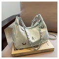 Chic light green hobo bag with silver butterfly charms and chain strap in soft leather - Green