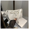 Detailed view of the white PU leather shoulder bag featuring drawstring design and gold eyelets - White