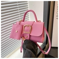 Close-up of pink PU leather crossbody bag with golden square buckle and mini coin purse - Pink