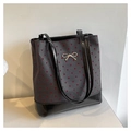 Detail of grey heart print tote featuring a black leather base and metal bow accent - Grey Heart (Without Pendant)