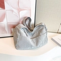 Silver-grey tote bag featuring unique crinkled texture and braided knot zipper detail - Silver