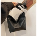 Minimalist black leather tote bag with geometric patchwork and wide shoulder strap - Black