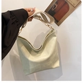 Minimalist beige slouchy hobo bag with quilted texture and wide shoulder strap - White