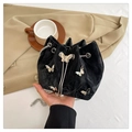 Black velvet drawstring bucket bag with silver butterfly charms and pearl chain strap - Black