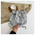 Silver wrinkled bucket bag with butterfly studs, pearl drawstring, and chain strap - Silver