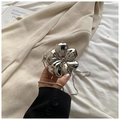 Close-up of a silver flower-shaped mini bag with metallic finish and fine chain strap - Silver