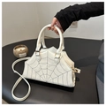 Chic white spider web shoulder bag with black embroidery and gold metal hardware - White