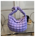 Detail of lavender quilted cloud tote bag with textured puffy fabric and gold zipper - Purple