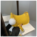 Detail of yellow crescent shoulder bag with V-quilted texture and gold chain strap - Yellow (With Pendant)