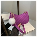 Detail of purple chevron-stitched hobo bag with gold hardware and white pompom charm - Purple (With Charm)