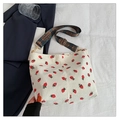 Off-white corduroy bucket bag with red strawberry print and ethnic woven wide strap - White