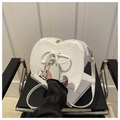 Detail of white heart-shaped crossbody bag with bat wings and lace-up design - White