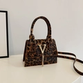 Brown leopard print mini crossbody bag with gold V-buckle and tassel detail - Brown