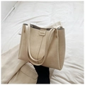 Minimalist apricot tote bag in textured faux leather with fashion embossed tag - White