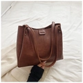 Brown leather tote bag with FASHION embossed detail and spacious interior compartment - Brown