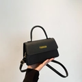 Sac à main noir en cuir litchi avec texte FASHION jaune et détails métalliques dorés - Noir