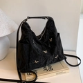 Black pleated hobo bag with silver butterfly charms and adjustable strap - Black