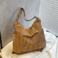 Versatile mustard tote bag featuring silver butterfly accents and pleated nylon texture - Brown