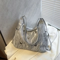 Silver wrinkled tote bag with metal butterfly accents and adjustable shoulder strap - Silver