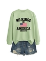 Flat lay of green sweatshirt with 1776 print and distressed denim shorts set - Olive Green (Black Graphics)