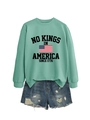 Detail of mint green crewneck sweatshirt with No Kings print and ripped denim shorts - Light Green (Black Graphics)