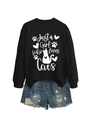 Detail of Just a Girl Who Loves Cats white print on a black crewneck sweatshirt - Black (White Font)