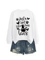 Detailed flat lay of white sweatshirt with cat-themed print and distressed denim shorts - White (Black Font)
