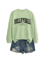 Detail view of Volleyball Mama varsity text and ball icon on light green cotton sweatshirt - Olive Green Sweatshirt (Black Font)