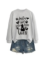 Flat lay of light grey cat slogan sweatshirt paired with distressed denim shorts - Grey (Black Font)