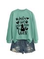 Detail of mint green sweatshirt with Just a Girl Who Loves Cats print and denim shorts - Light Green (Black Text)