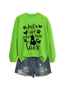 Detail of green sweatshirt with 'Just a Girl Who Loves Cats' print and denim shorts - Neon Green (Black Font)