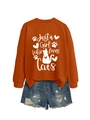 Flat lay of an orange cat-themed sweatshirt with distressed denim shorts on white background - Burnt Orange (White Font)