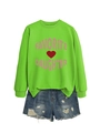 Flat lay of bright green crewneck sweatshirt with pink Favorite Daughter text and denim shorts - Fluorescent Green