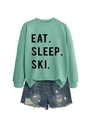 Detail of mint green sweatshirt with black Eat Sleep Ski lettering and distressed denim shorts - Light Green (Black Font)