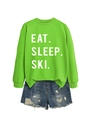 Detail of neon green Eat Sleep Ski sweatshirt and distressed denim shorts ensemble - Fluorescent Green (White Font)