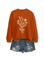 Détail du sweat-shirt orange à imprimé floral blanc Oma et short en jean bleu délavé - Orange Brûlé (Graphique Blanc)