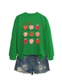 Dettaglio di una felpa verde con fragole e pantaloncini di jeans strappati - S / Verde erba (Grafica nera)