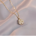Rotating four-leaf heart necklace in gold finish with sparkling pavé crystals on silk - Gold Heart Clover - White Zirconia