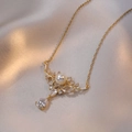 Elegant gold reindeer pendant necklace with white pearl and sparkling crystals on satin - Gold (Always With You Style)