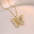 Gold butterfly pendant necklace featuring hollow mesh wings and zircon inlay - Butterfly Necklace / Gold
