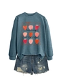 Detail of Teaching Is My Jam sweatshirt with strawberry print and frayed denim shorts - Blue (Black Print)