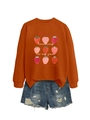 Detail of Teaching Is My Jam sweatshirt with strawberry prints and denim shorts - Rust Orange (White Graphic)