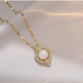 Elegant gold mermaid pearl necklace with zircon accents on a champagne silk background - Mermaid Pearl Zircon Necklace (with Pendant)
