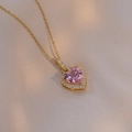 Pink heart crystal pendant necklace with gold chain and zircon border on silk background - Pink Heart Style / Pink