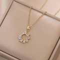 Golden titanium steel necklace featuring a flower-shaped zircon pendant on a velvet box - Gold Geometric Sunflower Zirconia Necklace (X1798)
